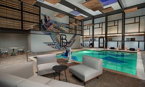 The Beeman Hotel in Dallas, image may contain: Pool, Water, Interior Design, Couch