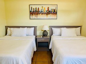 Morrison Hotel San Salvador in San Salvador, image may contain: Bed, Furniture, Lamp, Bedroom