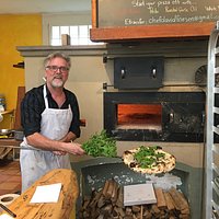 Fresh arugula on pizza. The pizza oven cooks a pizza in 90 seconds!!!