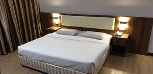 Hotel Samila in Alor Setar, image may contain: Interior Design, Indoors, Furniture, Bed