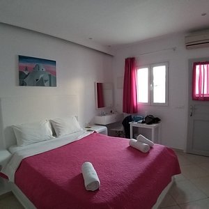 Milena Hotel in Mykonos, image may contain: Bed, Furniture, Bedroom, Handbag