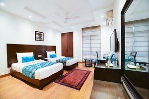 The Legend Inn in New Delhi, image may contain: Home Decor, Furniture, Bedroom, Interior Design