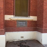 The Small Sign On The Church
