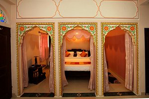 Hotel Moon Light Palace in Jaipur, image may contain: Furniture, Indoors, Bedroom, Interior Design