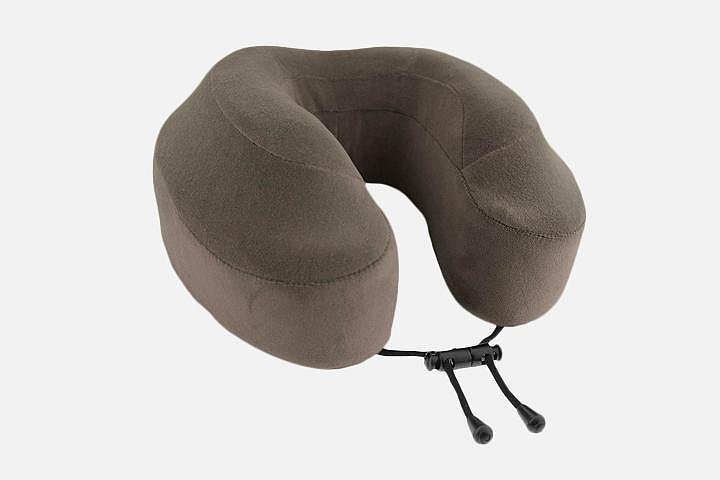 A brown memory foam travel page with an adjustable strap