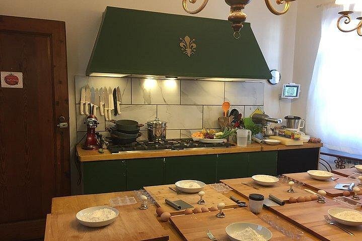 A kitchen set up with various cooking stations.