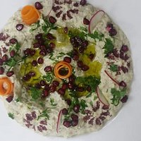 Mutable Salad. This salad is one of the most traditional mezze of the Middle East. Its made it with eggplant, tahini, yogurt garlic, olive oil and lemon juice. Mutable works great with grilled dishes such as Meat Kabab and kibbeh.