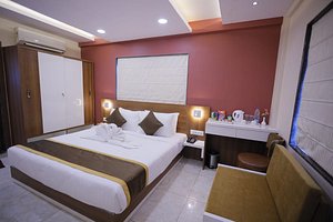 The Avenue Hotel at Ballygunge in Kolkata (Calcutta), image may contain: Chair, Furniture, Bed, Bedroom