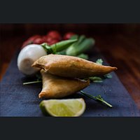 Samosas - lightly spiced vegetables encased in golden filo pastry