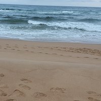 Tathra beach - The estuary meets the sea at the northern end of Tathra beach