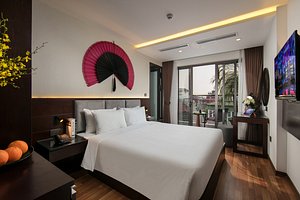Hanoi Fiesta Hotel & Spa in Hanoi, image may contain: Bed, Screen, Monitor, Penthouse