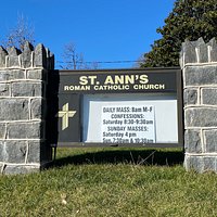 St. Ann's Roman Catholic Church sign with Mass listings