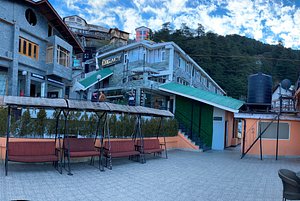 Sterling Legacy Shimla in Shimla, image may contain: Villa, Bench, Arch, Hotel