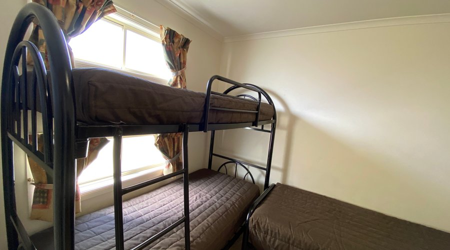 2nd Bedroom sleep 3. 1 x set of bunks, 1 x single bed.  Bring your own linen or linen packs available at an additional cost.