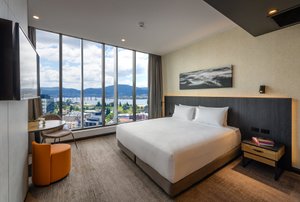 Mövenpick Hotel Hobart in Hobart, image may contain: Penthouse, Building, Interior Design, Furniture