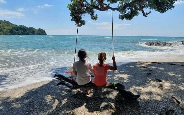 The swing makes for a beautiful picture.. but also fun to sit on as waves wash around your feet, as you look out at the beautiful view