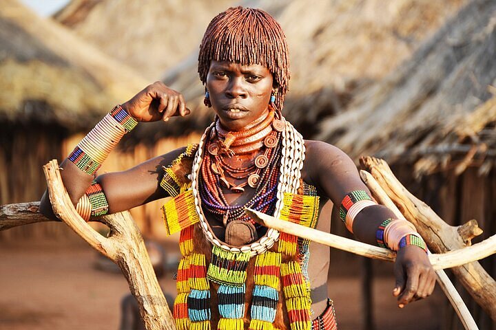 A group of tribal dancers engaged in a lively performance.