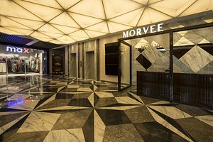 Morvee Hotels in Durgapur, image may contain: Floor, Flooring, Shopping Mall, Lighting