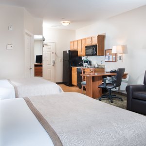 2 Queen Studio Suite with furnished kitchenette. 