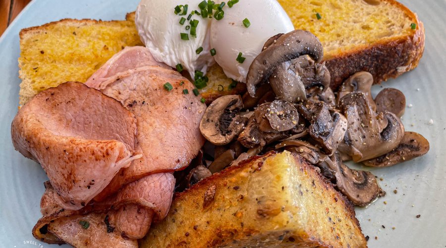 Hickory bacon and poched eggs, with sides and special of the day