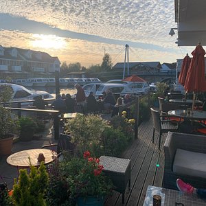Hotel Wroxham in Wroxham, image may contain: Waterfront, Neighborhood, Person, Woman
