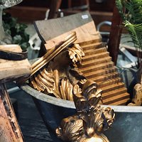 Gilt wood sconces and Italian washboard in a miniature roll top tin bath.