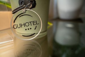 Gu Hotel in Guidonia Montecelio, image may contain: Logo, Bottle