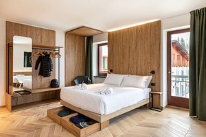 B&B Hotel Passo Tre Croci Cortina in Cortina d'Ampezzo, image may contain: Interior Design, Indoors, Furniture, Wood