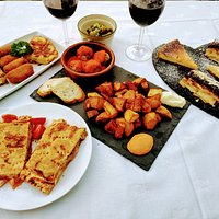 Spanish Tapas Menu. Tortilla, empanada, croquetas, bravas, albondigas. Tarta de queso y tarta de la abuela desserts.