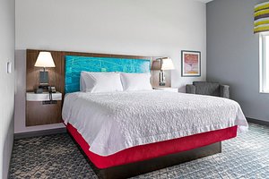 Hampton Inn & Suites Ypsilanti in Ypsilanti, image may contain: Furniture, Bed, Lamp, Interior Design