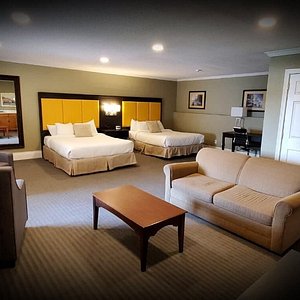 Waterfront rooms featuring 2 queen beds, sitting area & pullout couch, mini fridge & is spacious