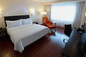 Hotel Opus Grand Toluca Aeropuerto in Toluca, image may contain: Bed, Furniture, Flooring, Chair