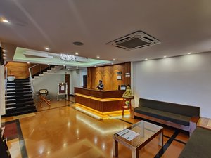 Driftwood Hotel & Resort in South Andaman Island, image may contain: Staircase, Table, Living Room, Flooring