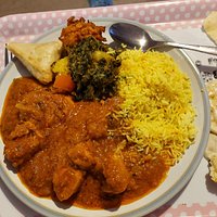 Take away chicken pathia, saag Aloo, pilau rice, veg samosa, and onion bhaji