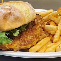 The Jenni. Hand breaded pork sandwich with mayo, lettuce & tomato. Served with choice of side.