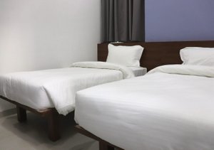 Sharman Suites in Pune, image may contain: Furniture, Bed