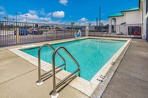Motel 6 Pensacola - N.A.S. in Pensacola, image may contain: Pool, Water, Swimming Pool, Outdoors