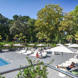 Novotel Resort & Spa Biarritz Anglet in Anglet, image may contain: Indoors, Foyer, Person, Furniture