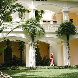 A lady walking along the corridor at the resort