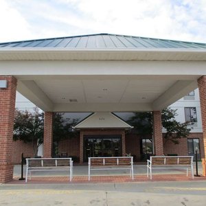 Best Western Warrensburg Inn in Warrensburg, image may contain: Bench, Furniture, Housing, Portico