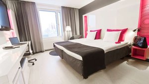 Scandic Tampere Station in Tampere, image may contain: Furniture, Home Decor, Laptop, Bedroom