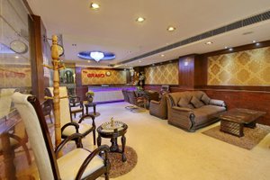 The Grand Hotel in Pathankot, image may contain: Couch, Living Room, Table, Home Decor