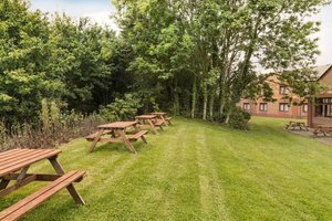 Days Inn by Wyndham Magor in Magor, image may contain: Grass, Backyard, Lawn, Desk