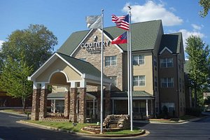 Country Inn & Suites by Radisson, Lawrenceville, GA in Lawrenceville, image may contain: Flag, City