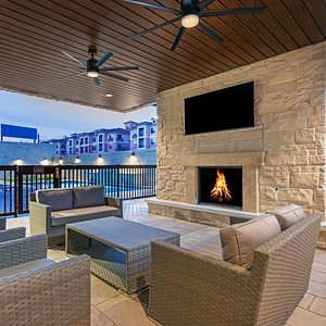 Outdoor Patio with TV and Fireplace.