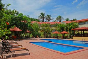 Country Inn & Suites by Radisson, San Jose Aeropuerto, Costa Rica in San Antonio De Belen, image may contain: Resort, Hotel, Building, Villa