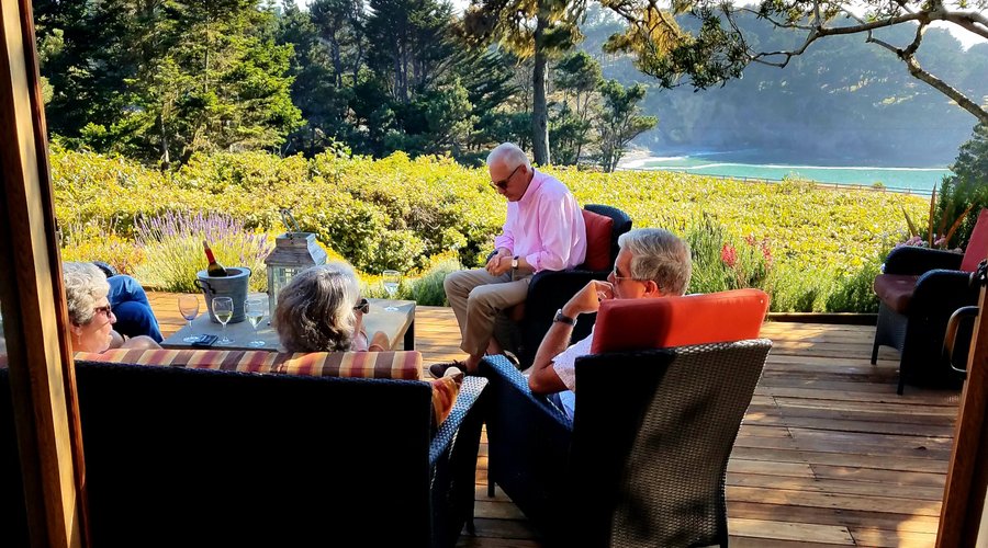 Guests enjoying the deck view of Smuggler's Cove.