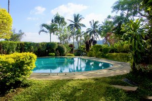 Hotel Coorg International in Madikeri, image may contain: Resort, Hotel, Garden, Villa