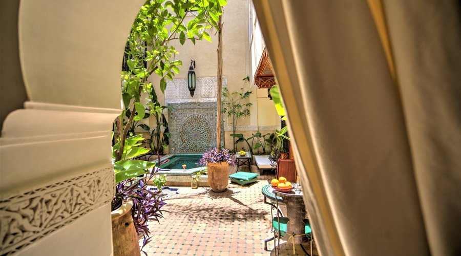 Traditional Isalamic archway leading to the leafy courtyard and plunge pool.