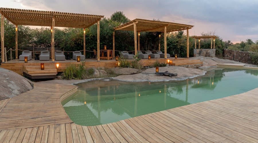 Pool with shaded lounge area.